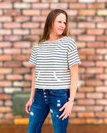Woman wearing a short sleeve cropped striped tee 