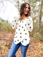 Detail view of dolman sleeve and crossover seam on wrap top