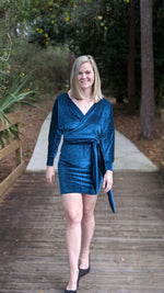 Woman wearing an Elegant velvet crossover wrap dress PDF pattern with fitted pencil skirt. 