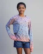 Girl wearing a cheetah print oversized long sleeve tee made using knit fabric and Ellie and Mac pdf sewing pattern.