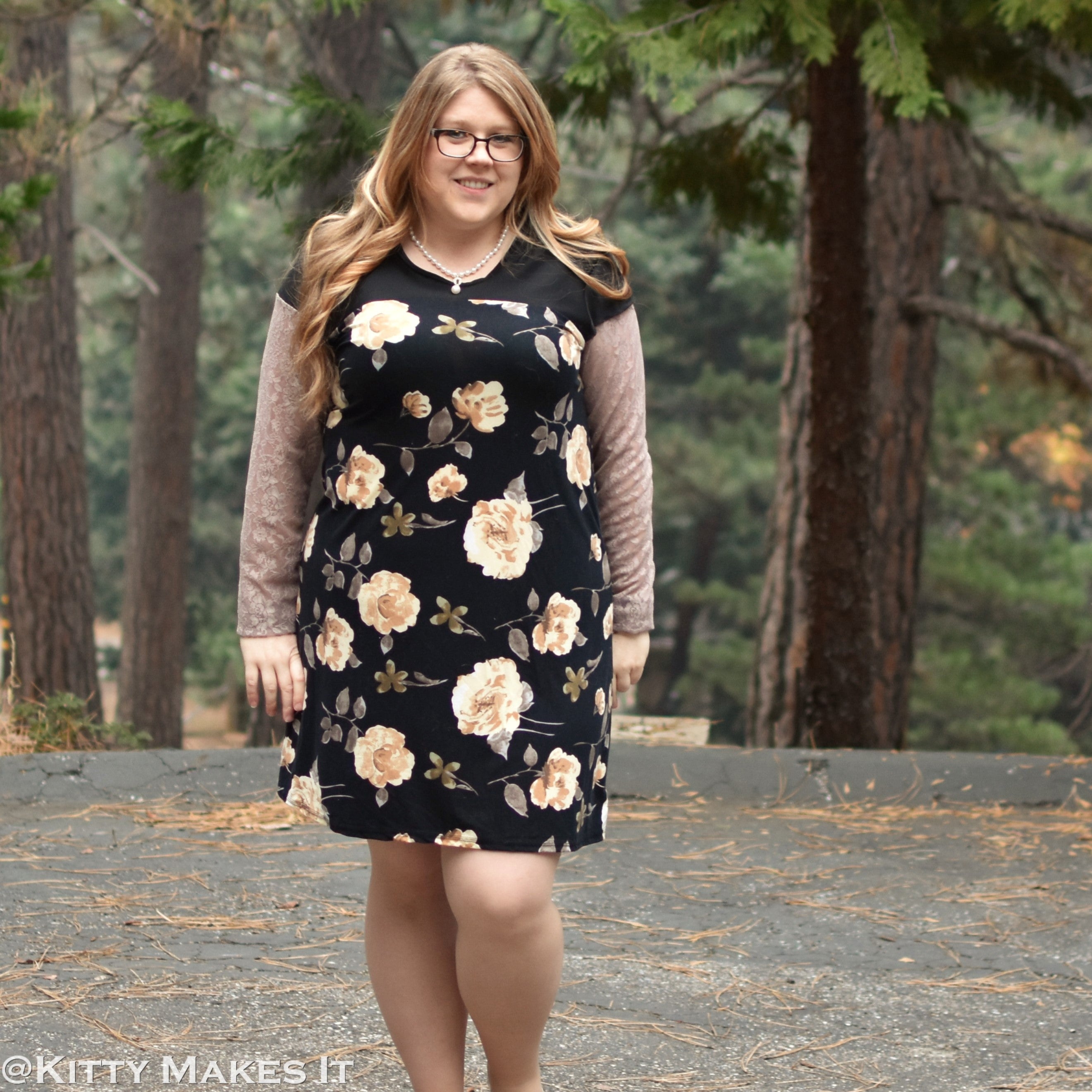 Easy womans knit casual dress sewing pattern - woman modeling black floral dress with black color-block  and lace long sleeves - Pretty summer dress - PDF sewing pattern