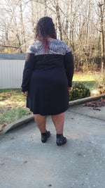 Plus size sewing pattern for a casual knit dress - woman modeling a black knit dress with color-block top bodice and shoulders. Long sleeve dress pattern - instant download