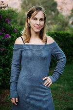 Woman with short brown hair wearing a blue ribbed sweater dress with an off shoulder banded neckline. Easy pdf sewing pattern.