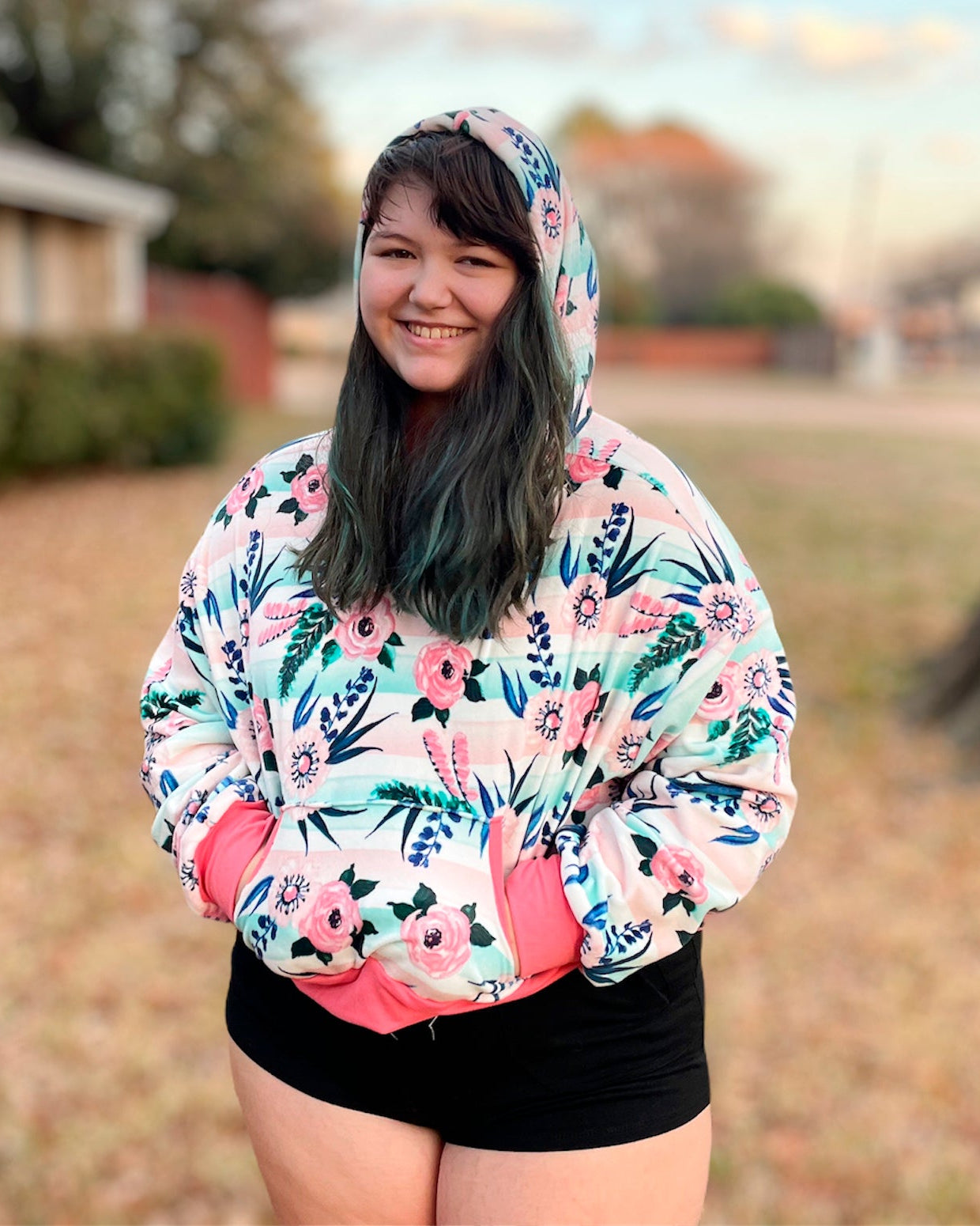 Teen wearing a cute striped and floral hooded cropped sweater. Made using Ellie and Mac Patterns